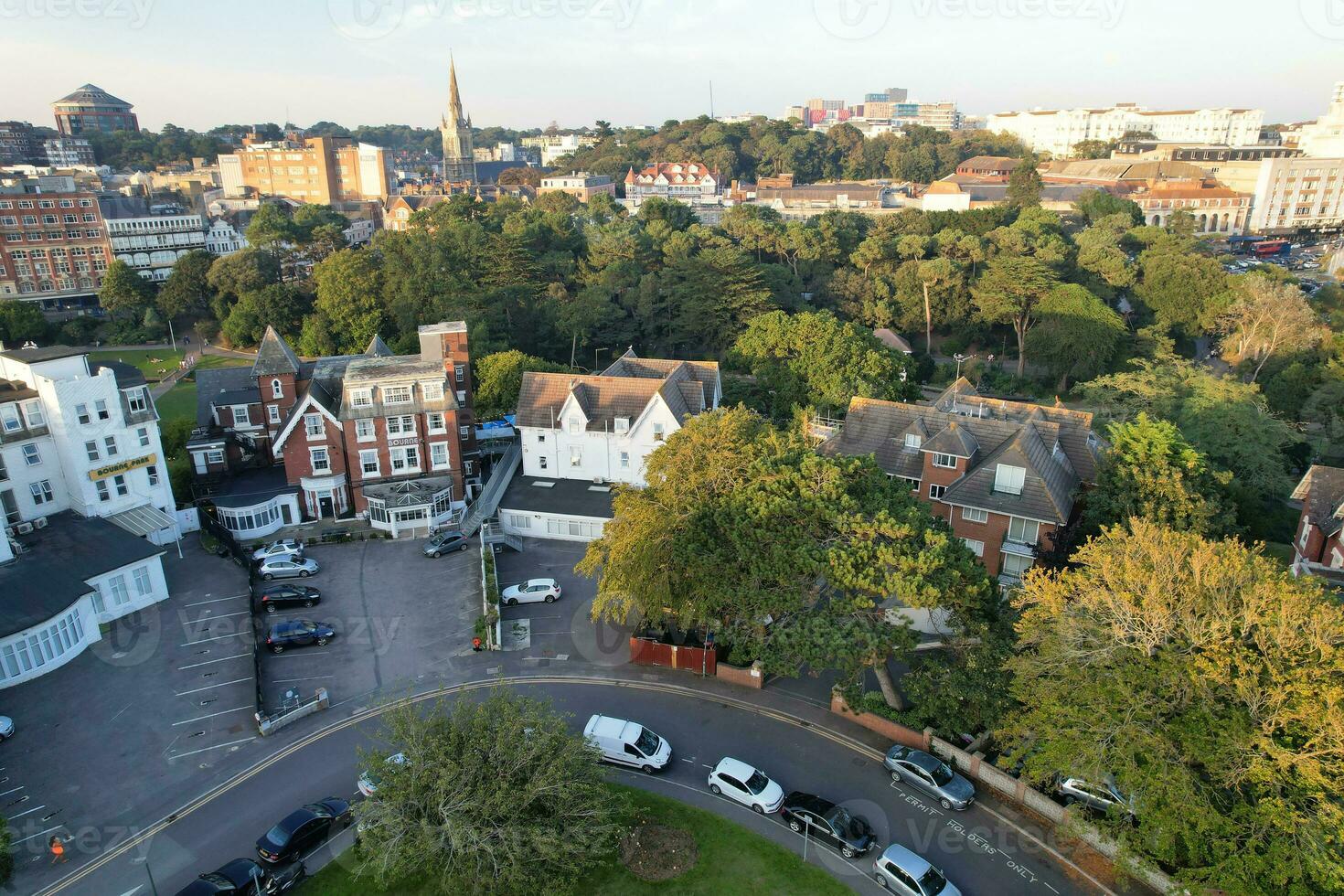 Aerial View of British Tourist Attraction of Bournemouth Beach and Sea view City of England Great Britain UK. Image Captured with Drone's Camera on September 9th, 2023 During Sunset photo