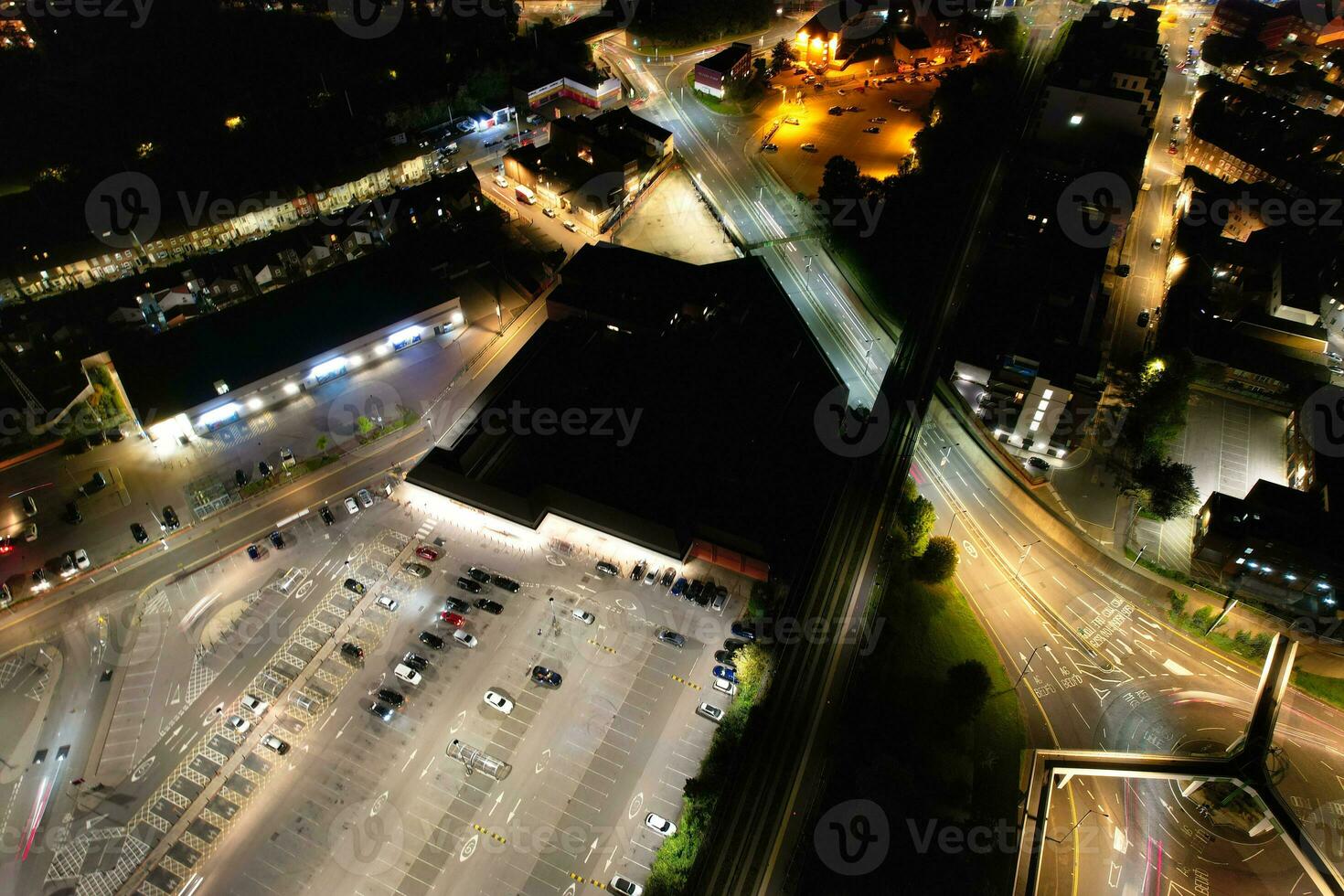 Aerial View of Illuminated Downtown Buildings, Roads and Central Luton City of England UK at Beginning of Clear Weather Night of September 5th, 2023 photo