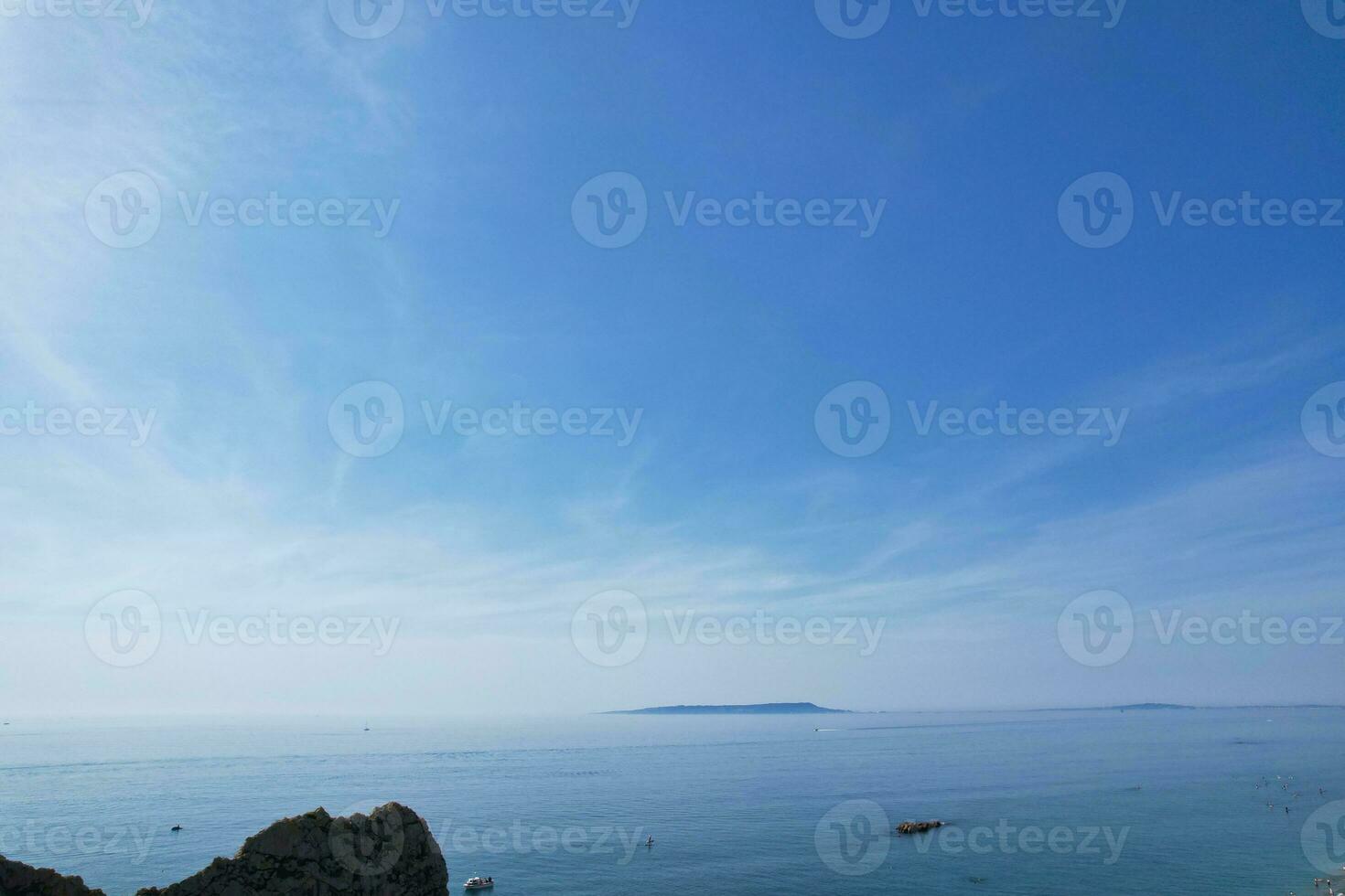 Most Beautiful View of British Landscape and Sea View of Durdle Door Beach of England Great Britain, UK. Image Was captured with Drone's camera on September 9th, 2023 photo