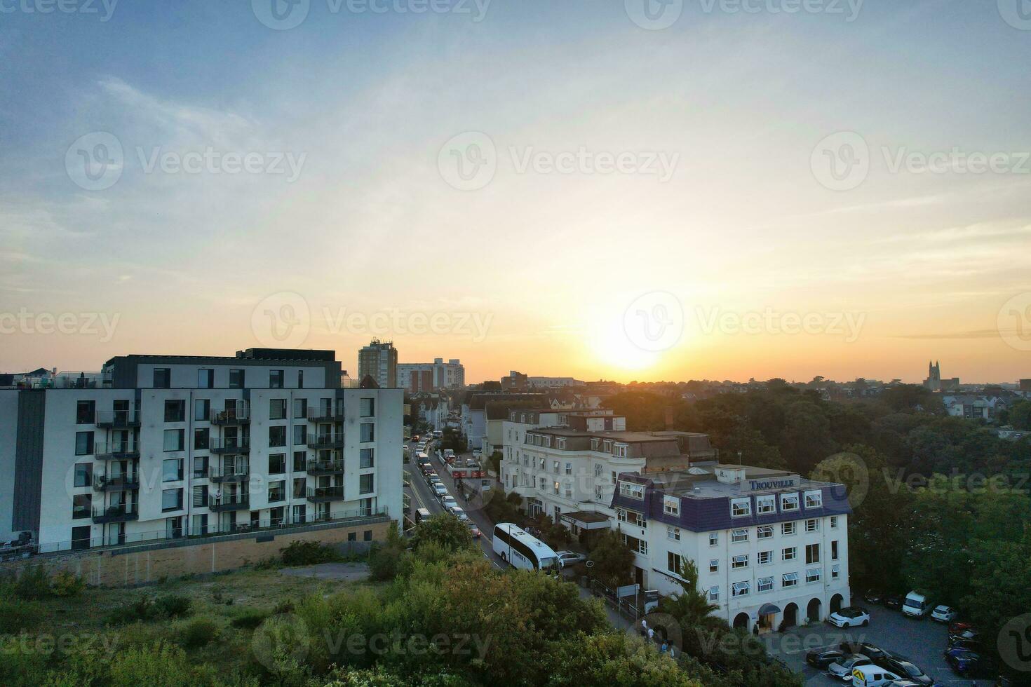 Aerial View of British Tourist Attraction of Bournemouth Beach and Sea view City of England Great Britain UK. Image Captured with Drone's Camera on September 9th, 2023 During Sunset photo