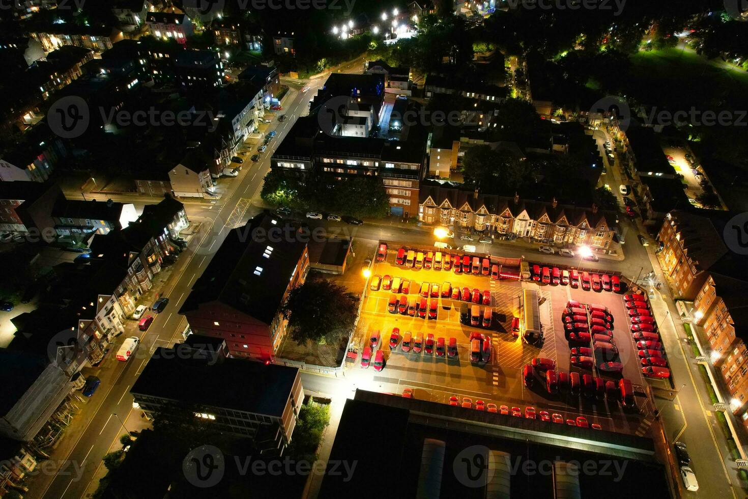 Aerial View of Illuminated Downtown Buildings, Roads and Central Luton City of England UK at Beginning of Clear Weather Night of September 5th, 2023 photo