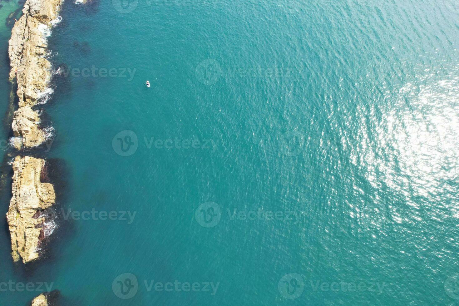 Most Beautiful View of British Landscape and Sea View of Durdle Door Beach of England Great Britain, UK. Image Was captured with Drone's camera on September 9th, 2023 photo