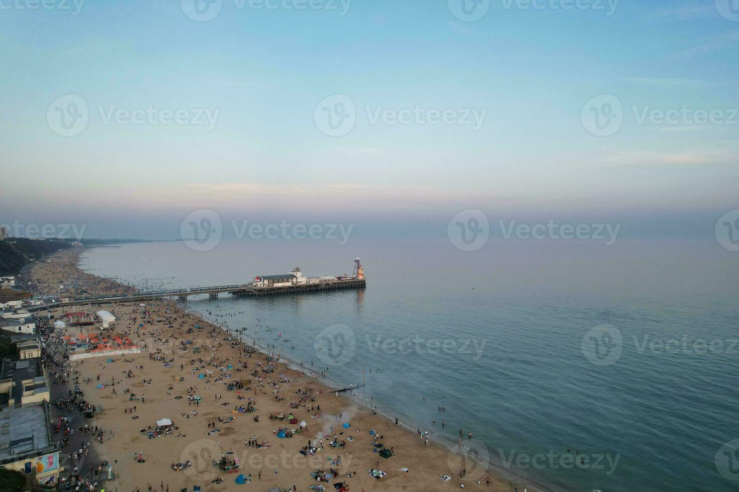 Beautiful Aerial Footage of British Tourist Attraction at Sea View of Bournemouth City of England Great Britain UK. High Angle Image Captured with Drone's Camera on September 9th, 2023 During Sunset photo