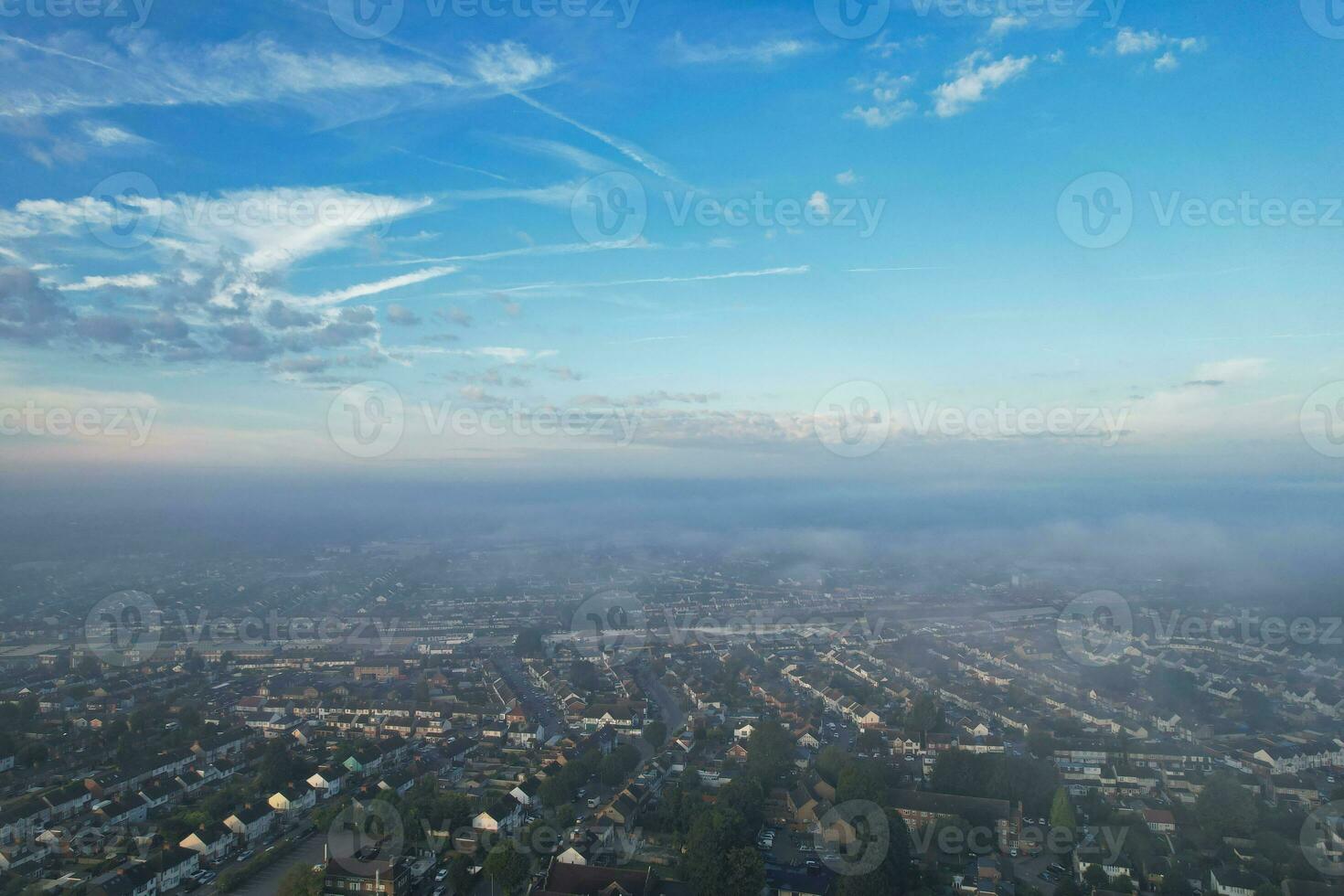 Most Beautiful and Best High Angle Dramatical Colourful Sky Footage from Above The Clouds. The Fast Moving Clouds During Sun rising Early in the Morning over Luton City of England UK photo