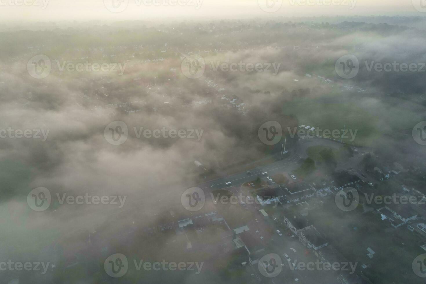 Most Beautiful and Best High Angle Dramatical Colourful Sky Footage from Above The Clouds. The Fast Moving Clouds During Sun rising Early in the Morning over Luton City of England UK photo