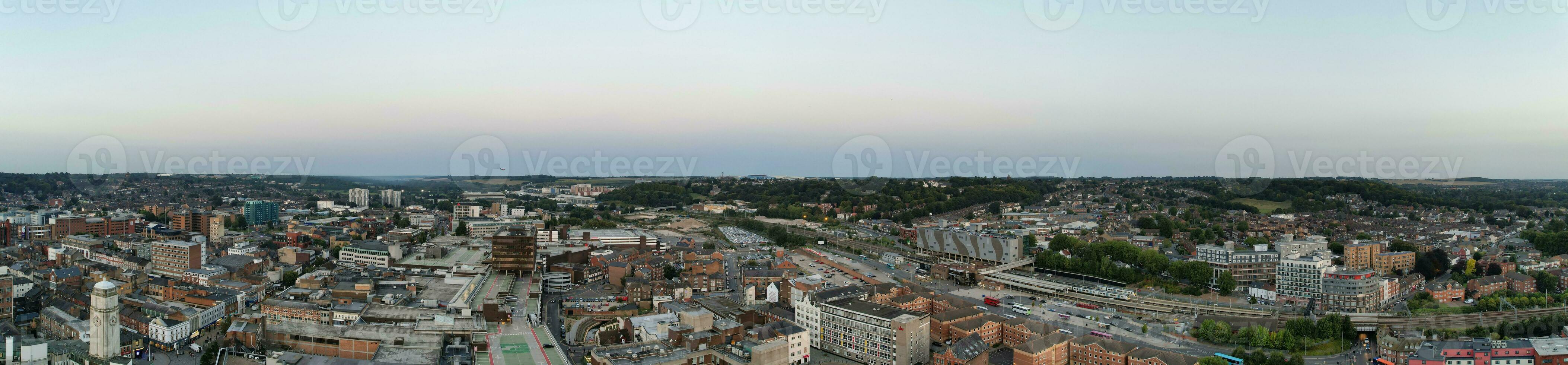 Ultra Wide Aerial Panoramic View of Illuminated Downtown Buildings, Roads and Central Luton City of England UK at Beginning of Clear Weather's Night of September 5th, 2023 photo