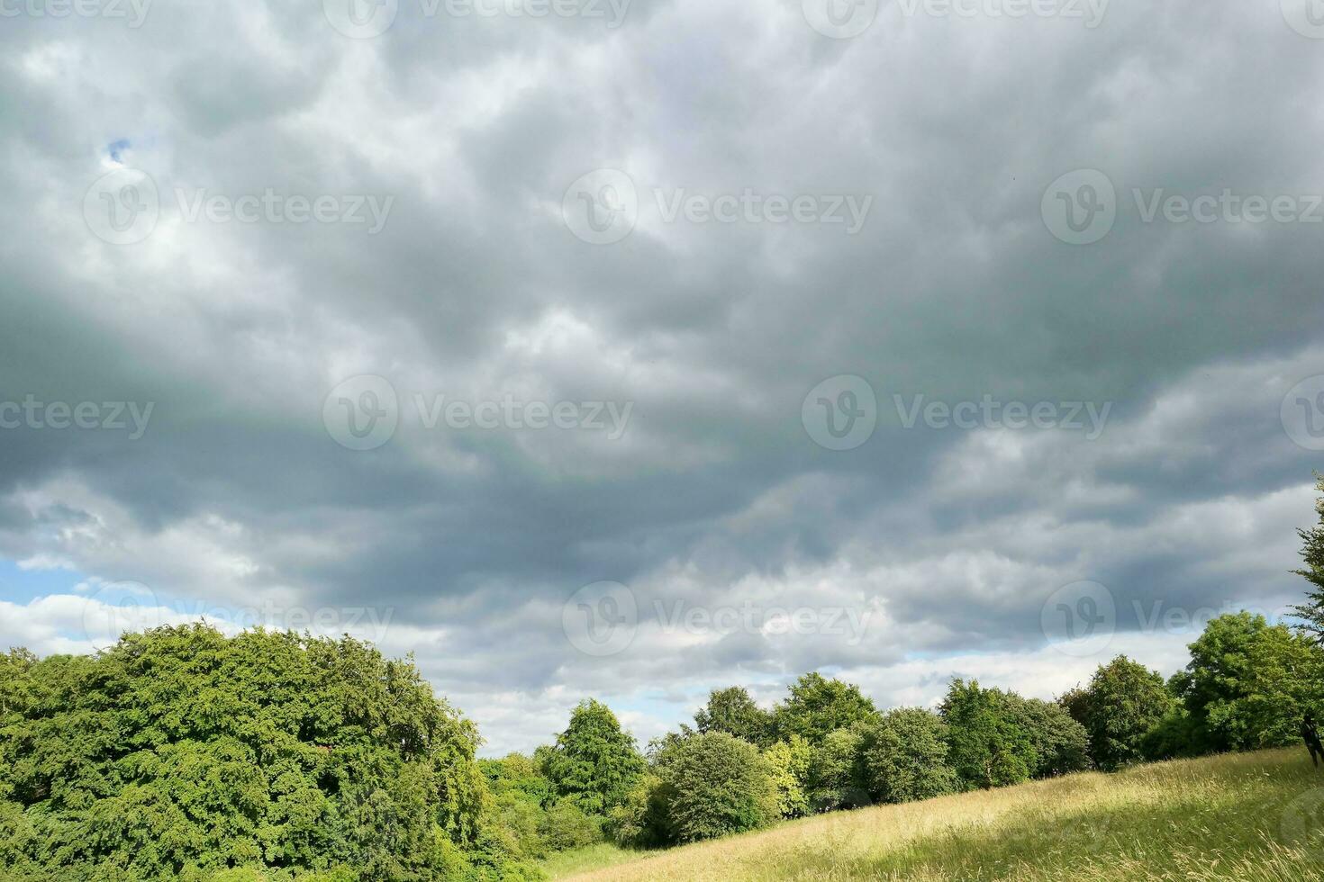 High Angle Footage of British Agricultural Farms at Countryside Landscape Nearby Luton City of England Great Britain of UK. Footage Was Captured with Drone's Camera photo