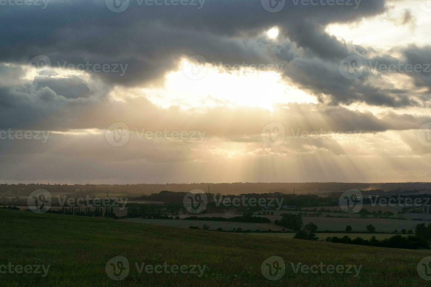 High Angle Footage of Most Beautiful Natural Orange Sunset with Orange Clouds and Sky over Luton City of England UK. Image Was Captured with drone's Camera on August 19th, 2023 photo