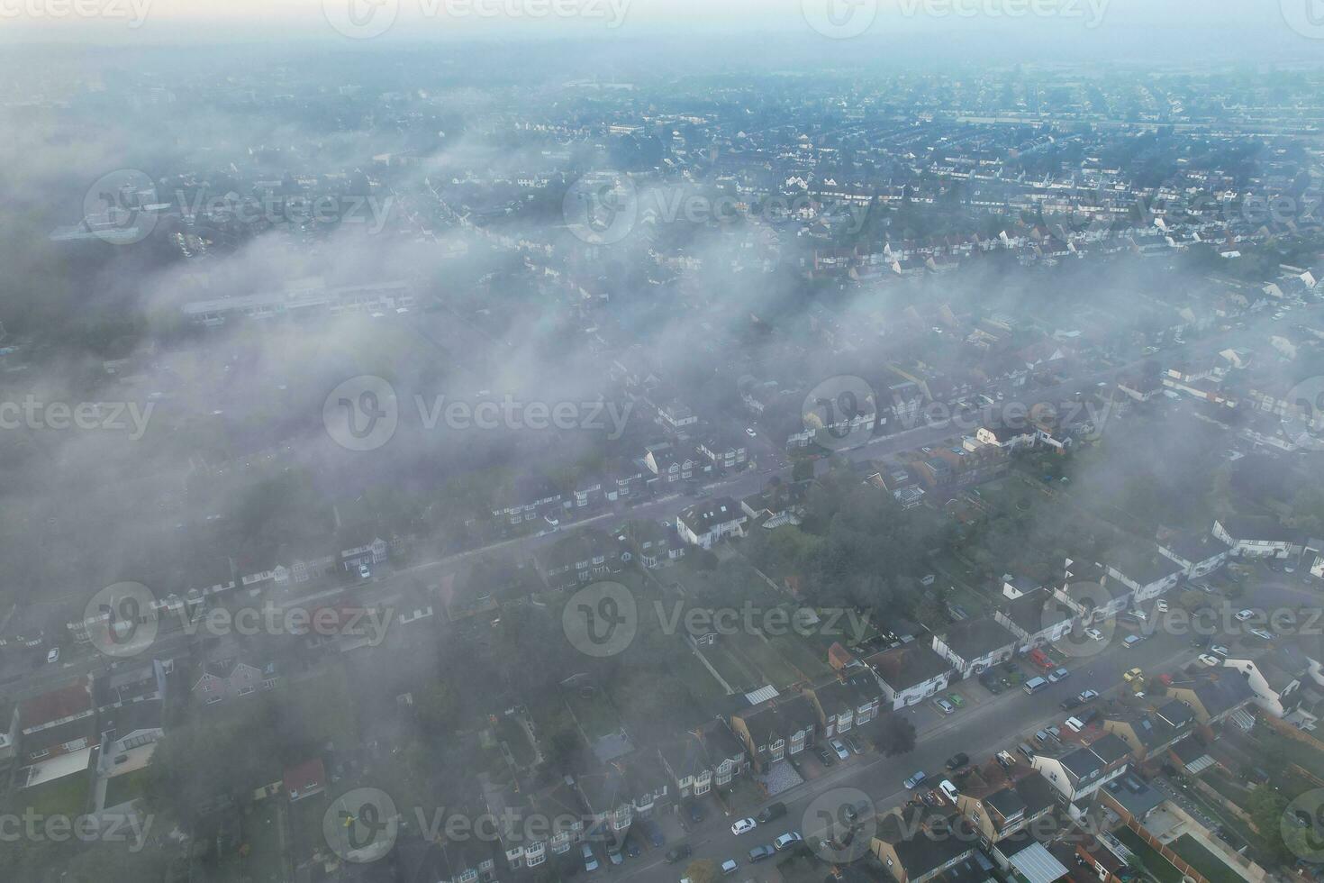 Most Beautiful and Best High Angle Dramatical Colourful Sky Footage from Above The Clouds. The Fast Moving Clouds During Sun rising Early in the Morning over Luton City of England UK photo