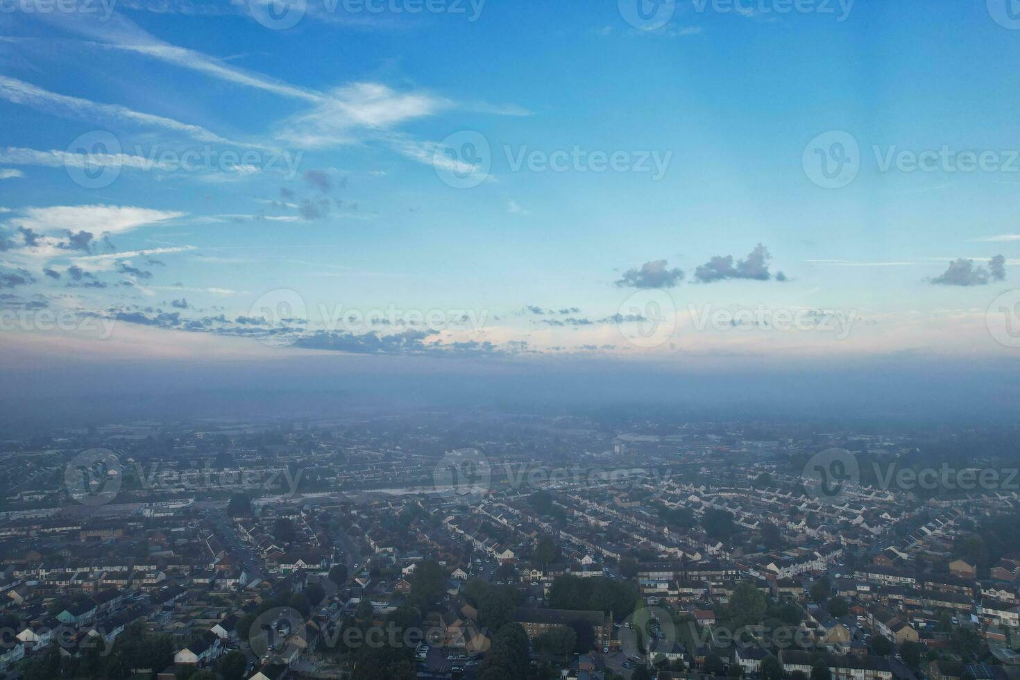 Most Beautiful and Best High Angle Dramatical Colourful Sky Footage from Above The Clouds. The Fast Moving Clouds During Sun rising Early in the Morning over Luton City of England UK photo