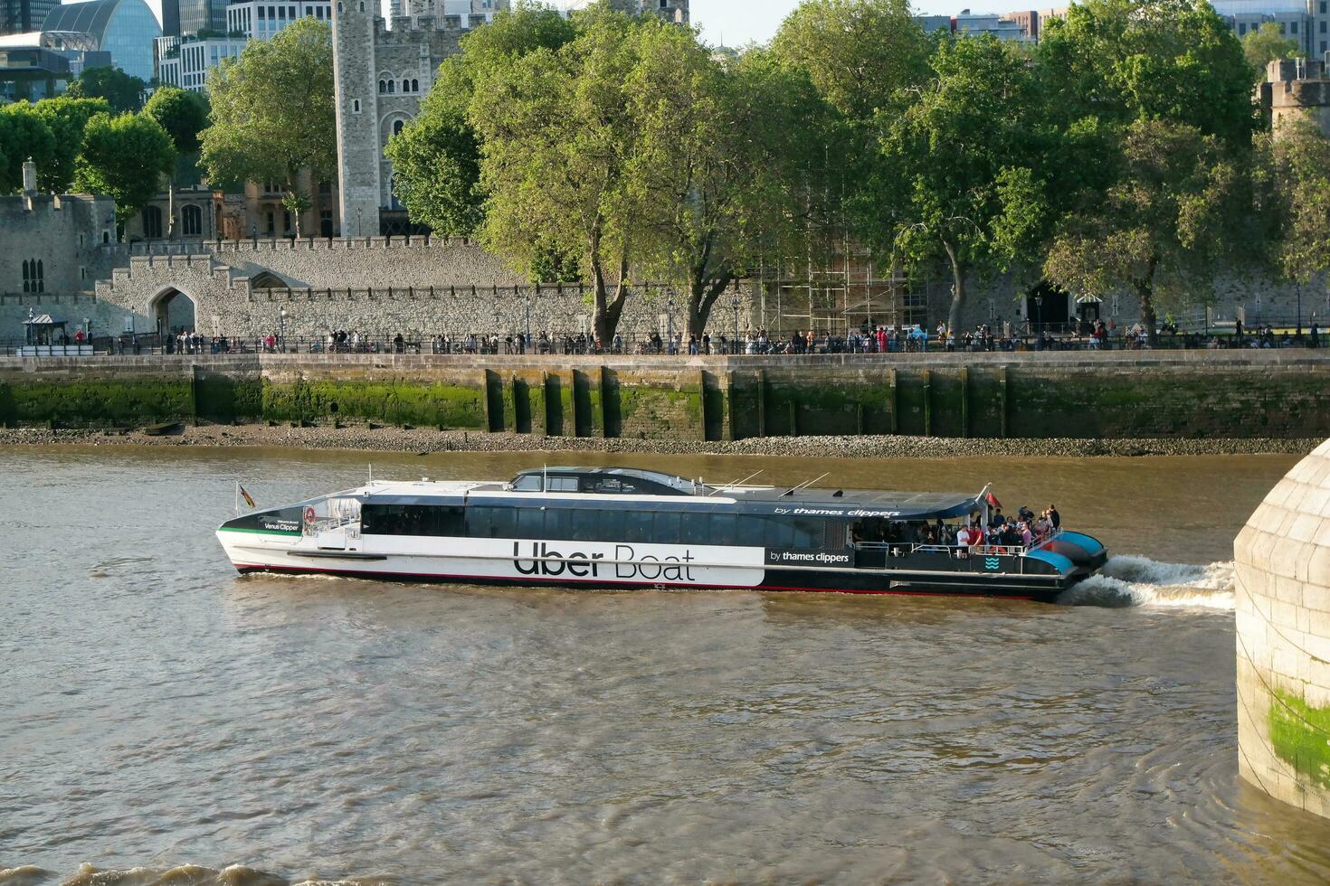Best View of Boat over River Thames Waters at London Bridge, Capital City of England Great Britain. The Image Was Captured June 4th, 2023 photo