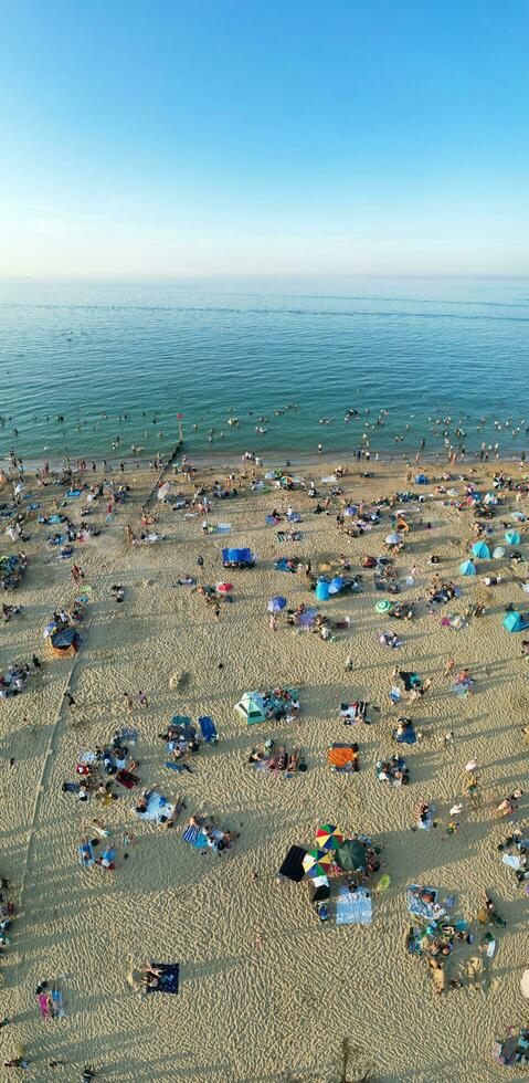 Vertical Aerial Panoramic of British Tourist Attraction at Sea View of Bournemouth City of England Great Britain UK. High Angle Image Captured with Drone's Camera on September 9th, 2023 During Sunset photo