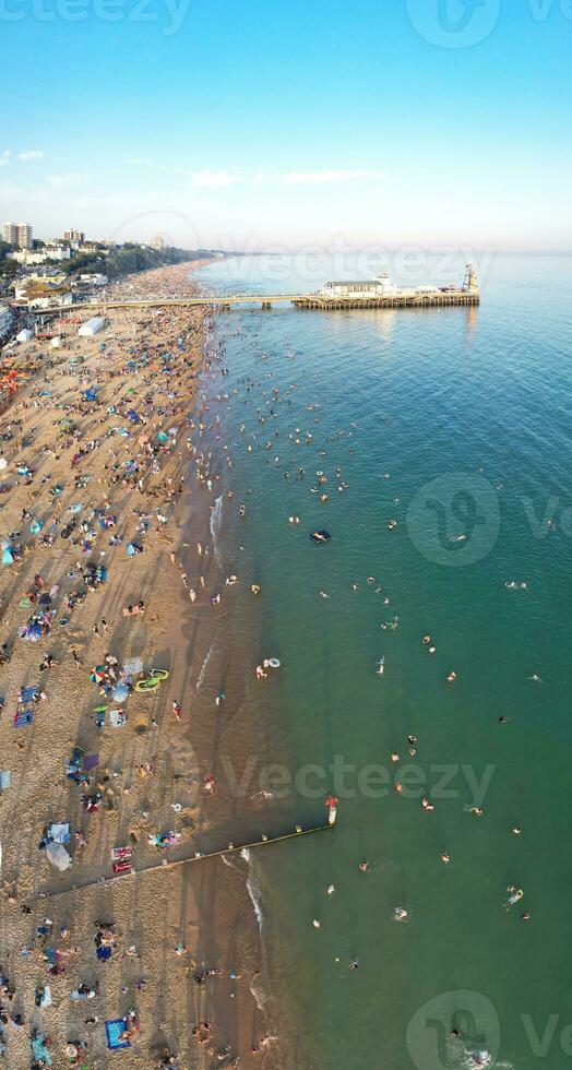 Vertical Aerial Panoramic of British Tourist Attraction at Sea View of Bournemouth City of England Great Britain UK. High Angle Image Captured with Drone's Camera on September 9th, 2023 During Sunset photo