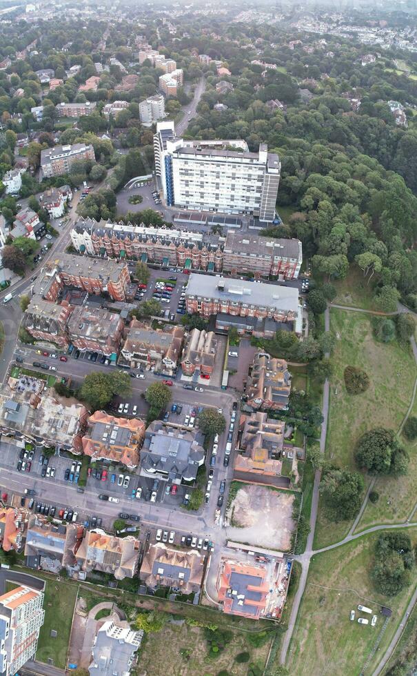 Vertical Aerial Panoramic of British Tourist Attraction at Sea View of Bournemouth City of England Great Britain UK. High Angle Image Captured with Drone's Camera on September 9th, 2023 During Sunset photo