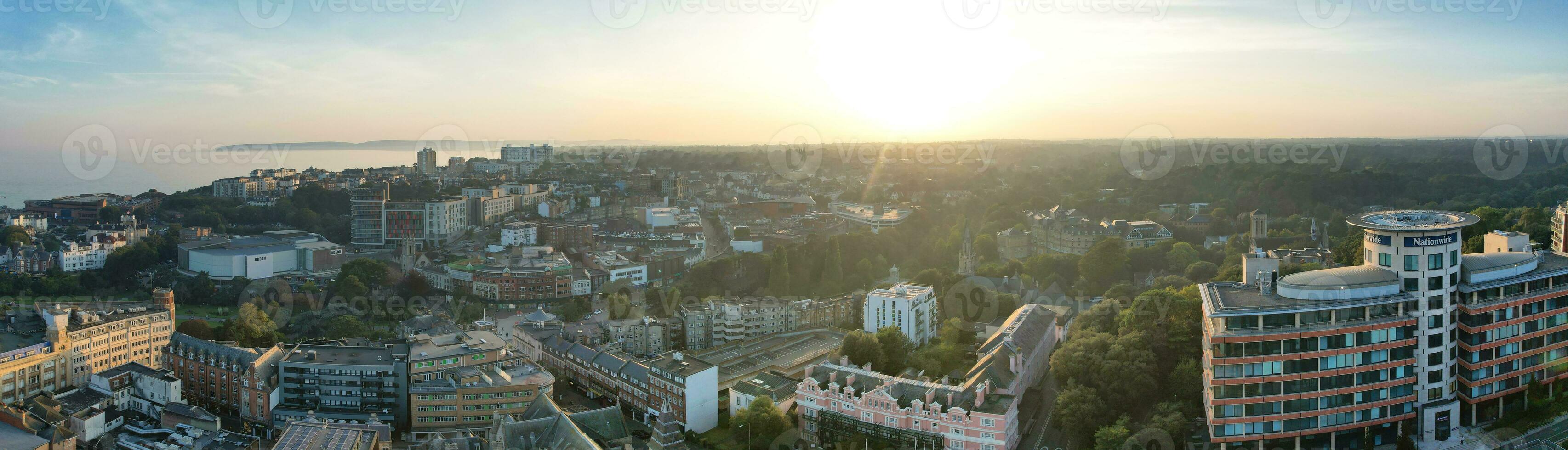 Aerial Panoramic View of British Tourist Attraction at Sea View of Bournemouth City of England Great Britain UK. High Angle Image Captured with Drone's Camera on September 9th, 2023 During Sunset photo