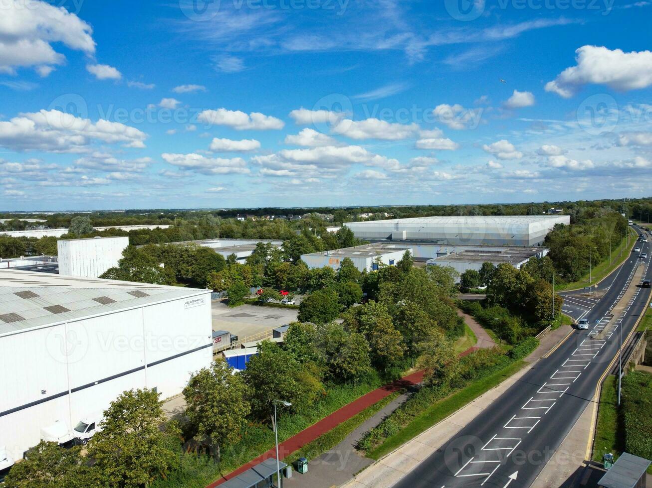 High Angle Footage of British Road and Traffic at Caldecotte Lake of Milton Keynes City of England Great Britain, Beautiful View Captured on August 21st, 2023 with Drone's Camera During Sunny Day photo