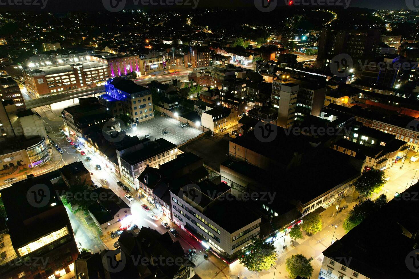 Aerial View of Illuminated Downtown Buildings, Roads and Central Luton City of England UK at Beginning of Clear Weather Night of September 5th, 2023 photo