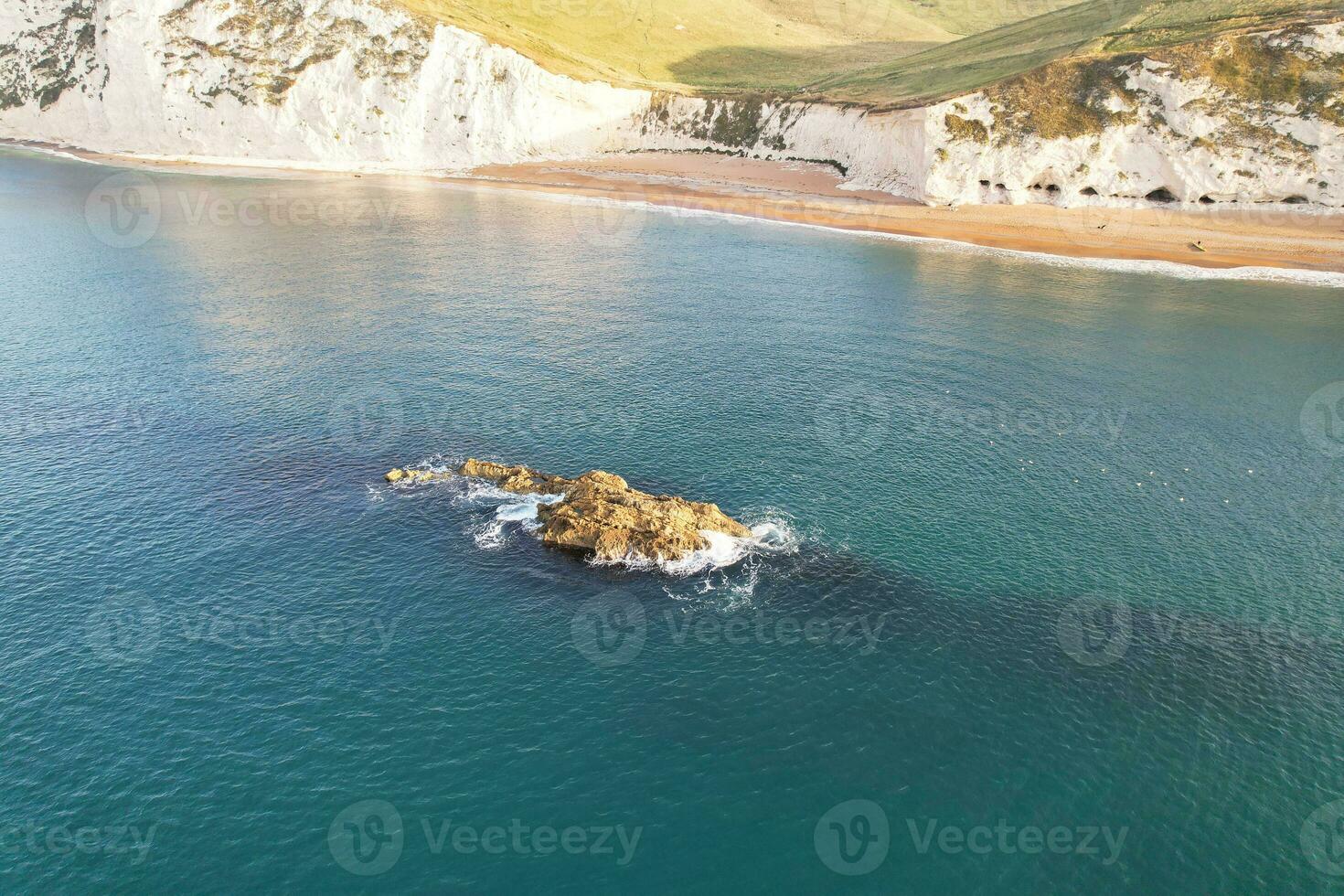 Most Beautiful View of British Landscape and Sea View of Durdle Door Beach of England Great Britain, UK. Image Was captured with Drone's camera on September 9th, 2023 photo