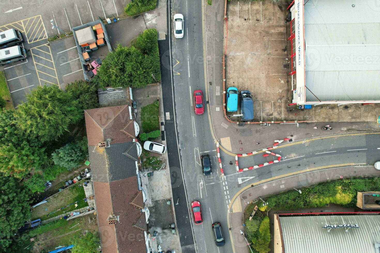 Aerial View of Residential Real Estate with Industrial Estate Combined District of North of Luton City of England, Great Britain, UK.  Footage Was Captured with Drone's Camera on September 7th, 2023 photo