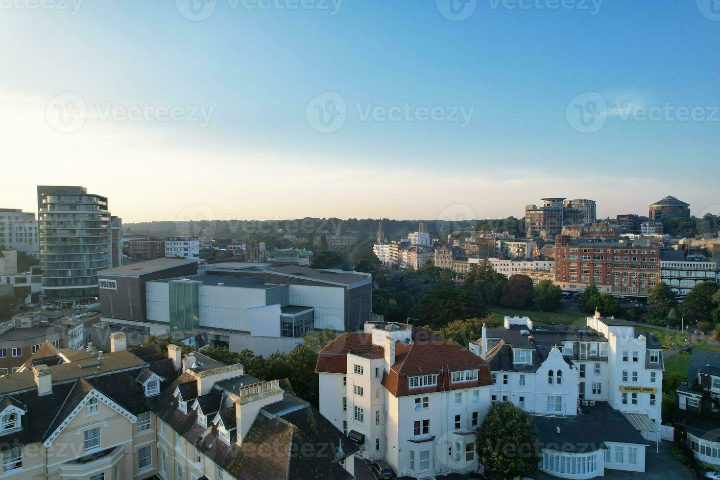 Aerial View of British Tourist Attraction of Bournemouth Beach and Sea view City of England Great Britain UK. Image Captured with Drone's Camera on September 9th, 2023 During Sunset photo