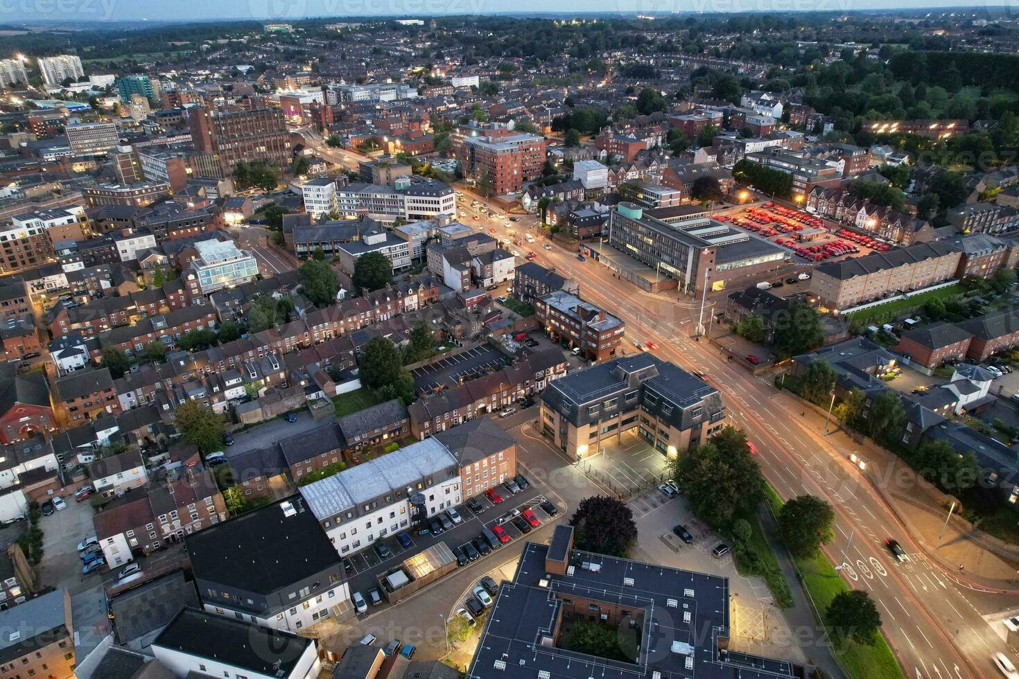 Aerial View of Illuminated Downtown Buildings, Roads and Central Luton City of England UK at Beginning of Clear Weather Night of September 5th, 2023 photo