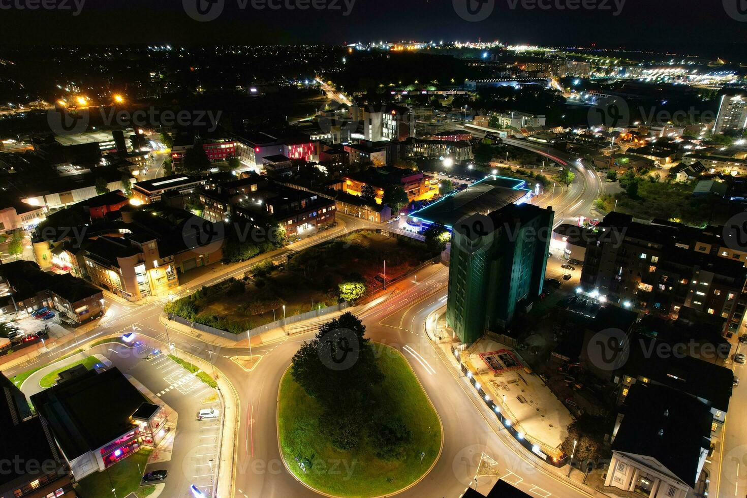 Aerial View of Illuminated Downtown Buildings, Roads and Central Luton City of England UK at Beginning of Clear Weather Night of September 5th, 2023 photo