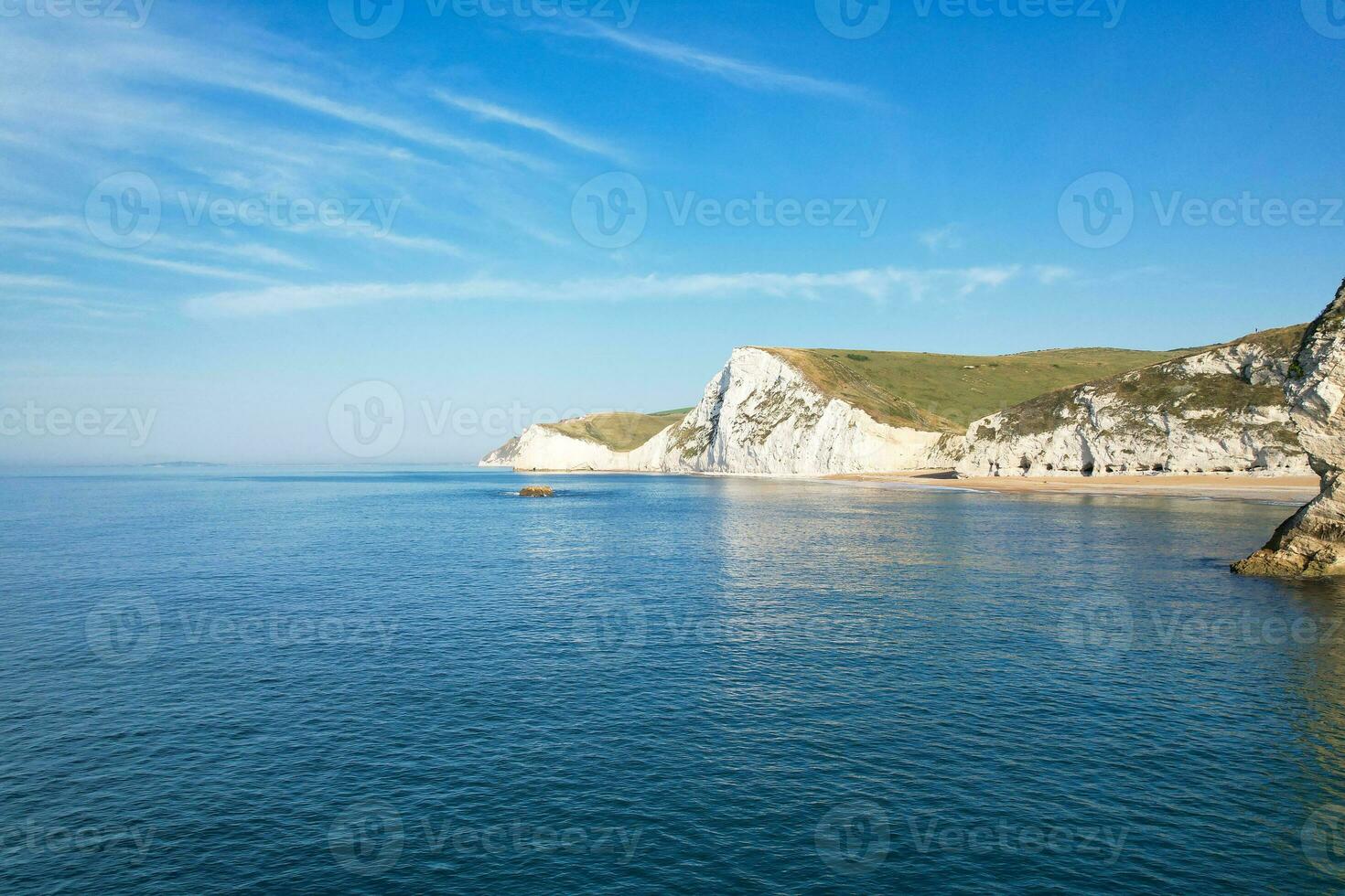 Most Beautiful View of British Landscape and Sea View of Durdle Door Beach of England Great Britain, UK. Image Was captured with Drone's camera on September 9th, 2023 photo