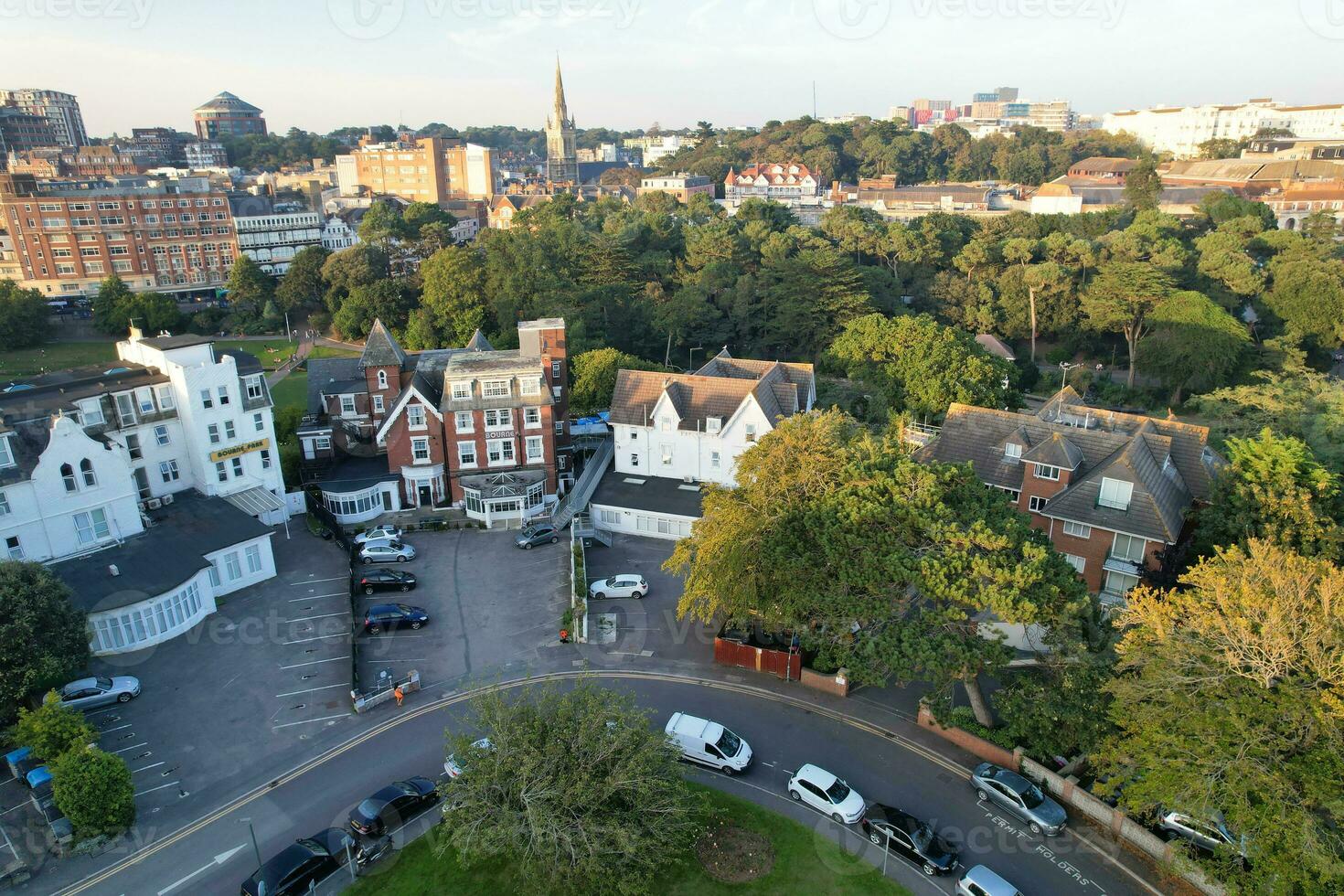 Aerial View of British Tourist Attraction of Bournemouth Beach and Sea view City of England Great Britain UK. Image Captured with Drone's Camera on September 9th, 2023 During Sunset photo