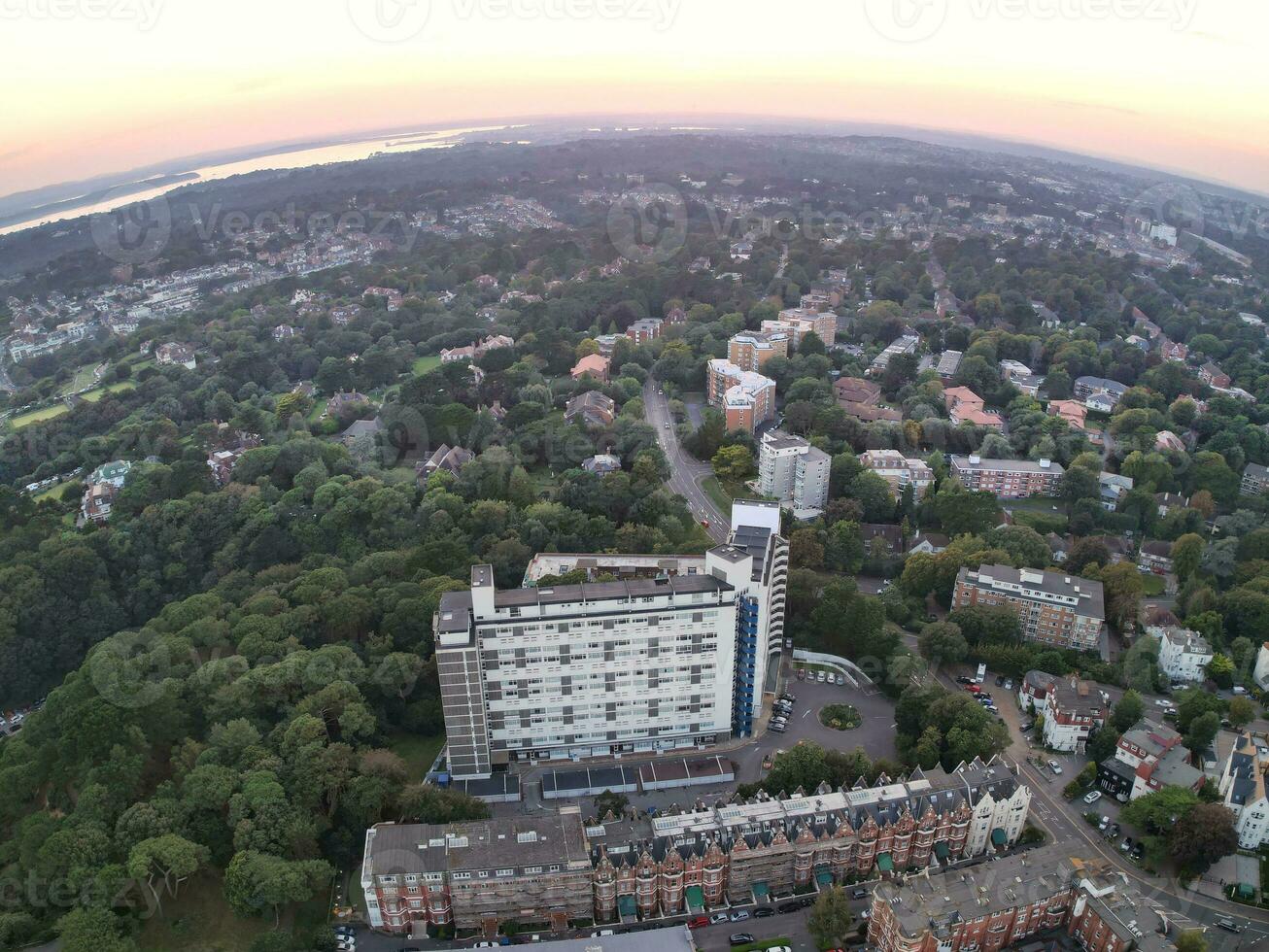 Aerial Panoramic View of British Tourist Attraction at Sea View of Bournemouth City of England Great Britain UK. High Angle Image Captured with Drone's Camera on September 9th, 2023 During Sunset photo