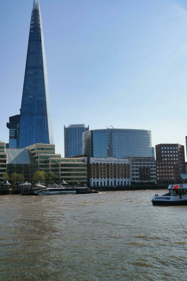 Best View of Boat over River Thames Waters at London Bridge, Capital City of England Great Britain. The Image Was Captured June 4th, 2023 photo