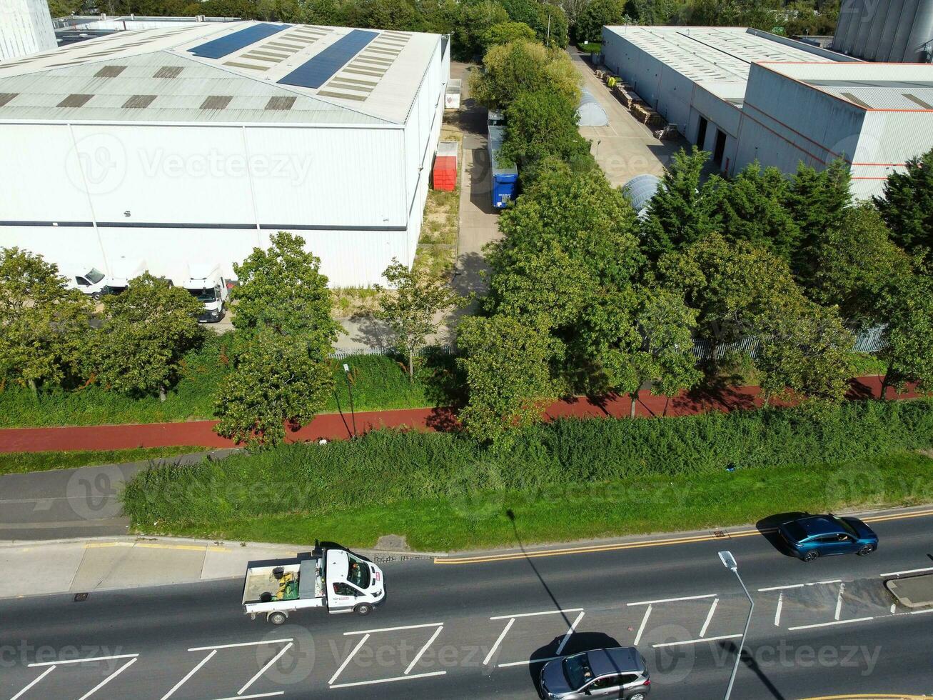 High Angle Footage of British Road and Traffic at Caldecotte Lake of Milton Keynes City of England Great Britain, Beautiful View Captured on August 21st, 2023 with Drone's Camera During Sunny Day photo