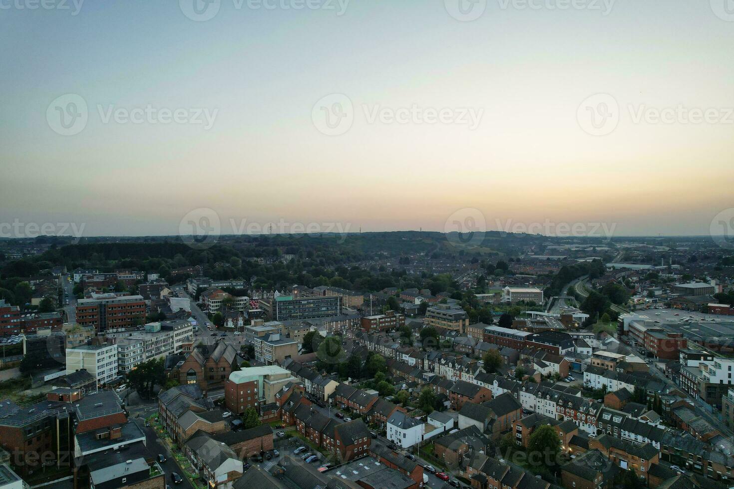 Aerial View of Illuminated Downtown Buildings, Roads and Central Luton City of England UK at Beginning of Clear Weather Night of September 5th, 2023 photo