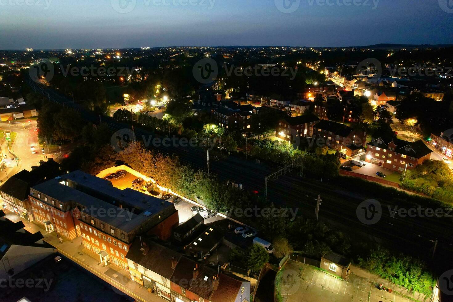 Aerial View of Illuminated Downtown Buildings, Roads and Central Luton City of England UK at Beginning of Clear Weather Night of September 5th, 2023 photo