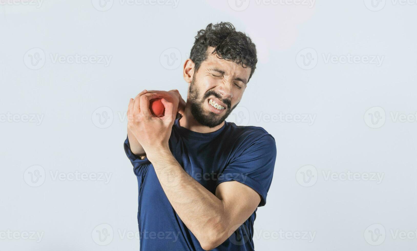 Man with elbow cramp, Person with elbow pain isolated, concept of a man with rheumatism elbow pain, man massaging sore elbow photo