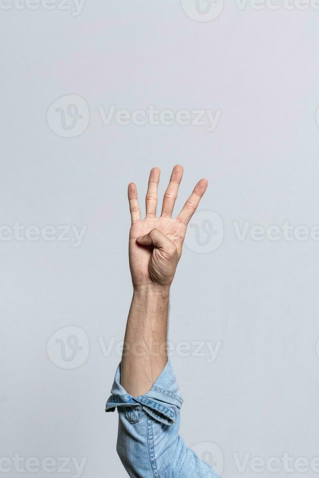 Hand counting number four, Man hand showing number four, Guy finger counting number four on isolated background photo