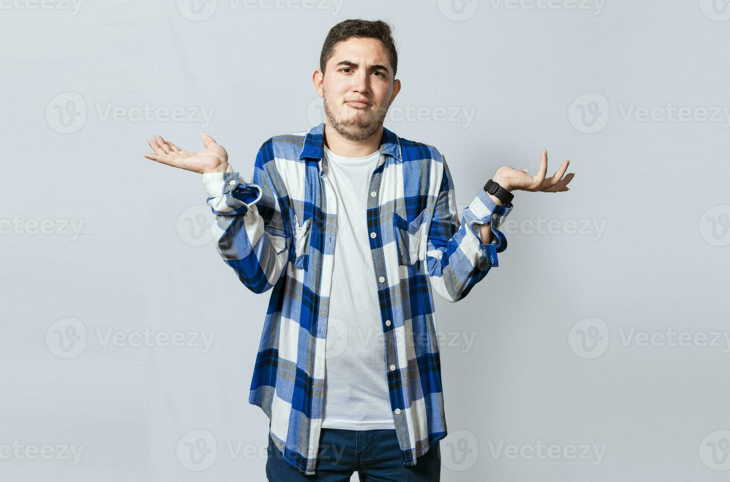 Man spreading palms, feeling clueless and uncertain. Person with puzzled gesture spreading hands, Concept of a puzzled man spreading hands isolated. Guy with puzzled gesture spreading palms photo
