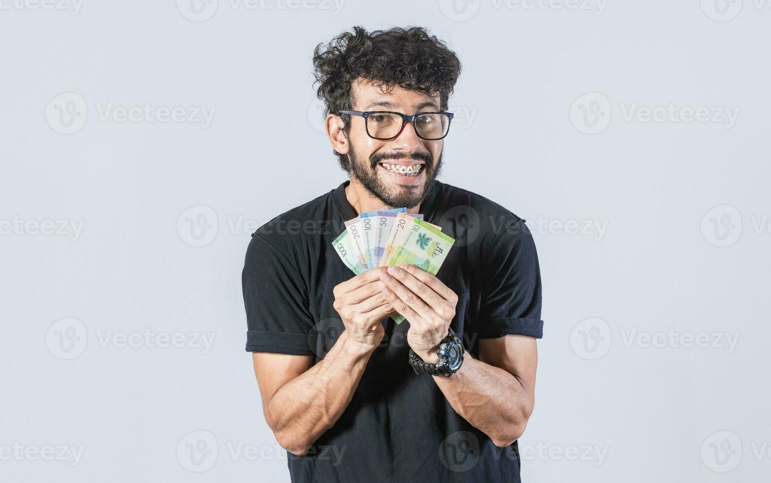 Happy man with money in hand, joyful man with bills in hand, concept of man with money isolated photo