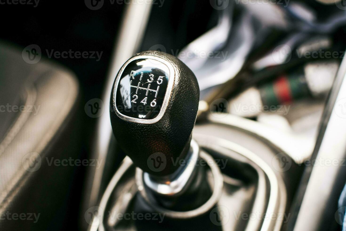 Manual gear lever of a car. Close up of a car gear stick manual transmission, Image of a car gear stick manual transmission. photo