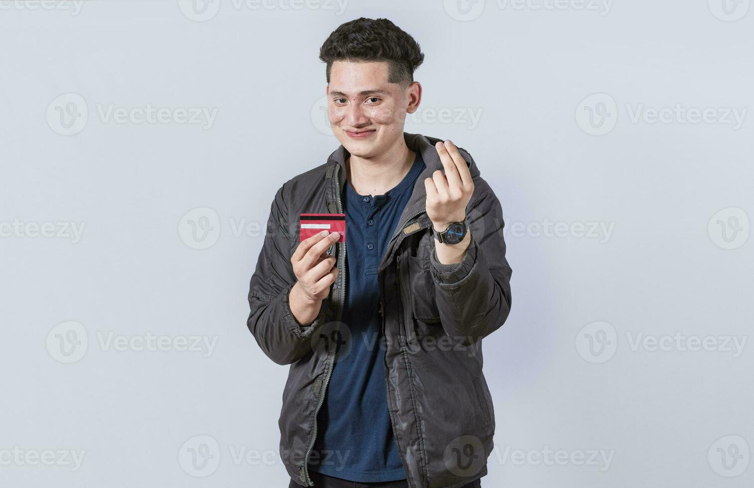 Handsome man holding credit card, A guy holding credit card smiling, electronic payment concept photo