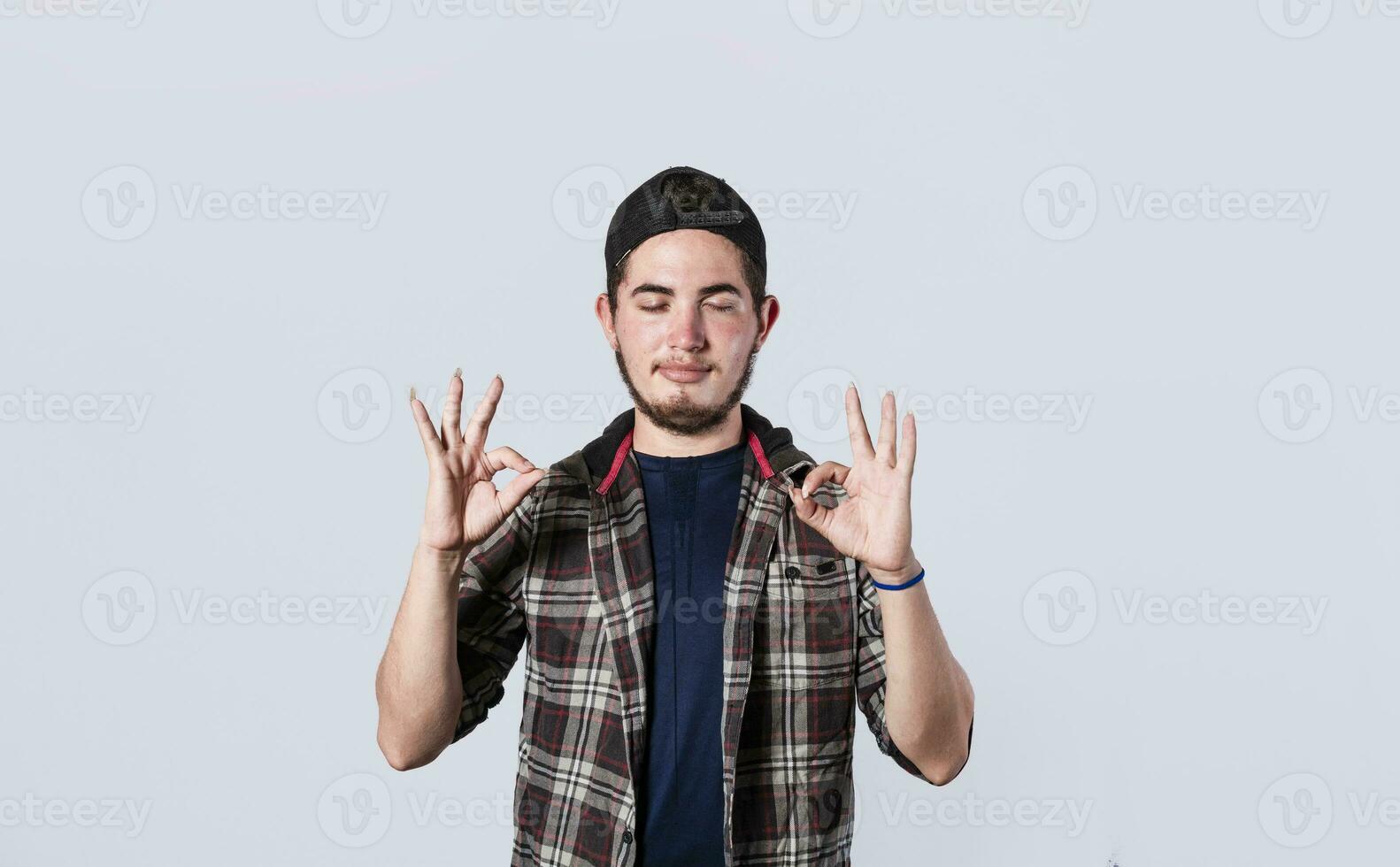 Concept of no problem, young man making ok gesture, expression of everything is fine. photo