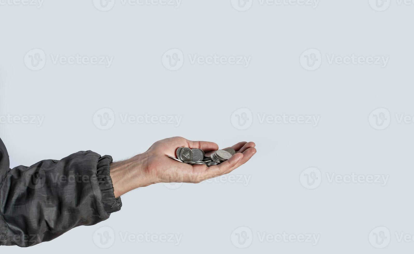 Hands with several coins in isolated background, Close up of hand with several coins, currency savings concept photo