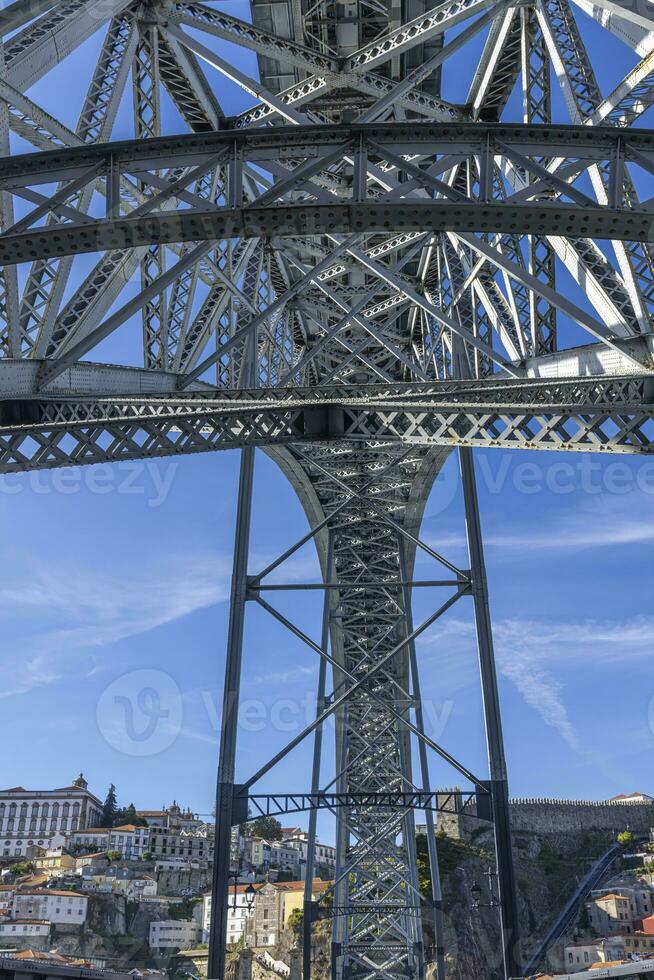 Vertical panoramic image of the load-bearing metal structure of the Ponte Dom Luis bridge during the daytime photo