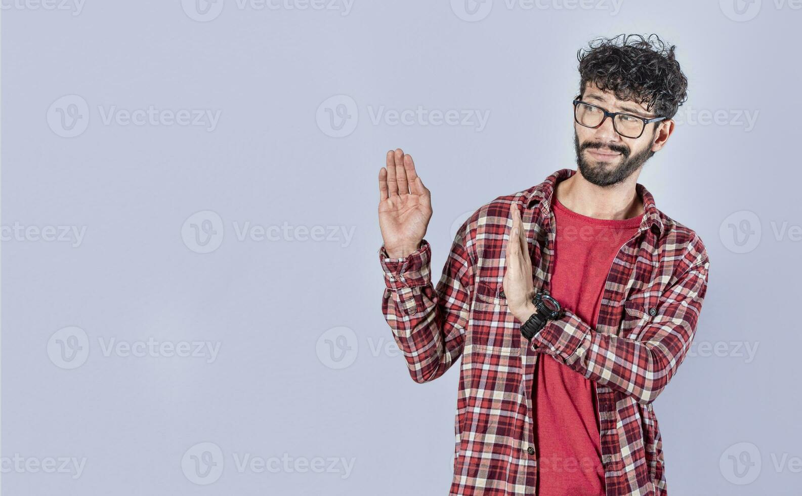 Displeased intense man with rejection gesture, pulls palms in rejection, frowns in disgust. Displeased person rejecting with rejection gesture, throw palms isolated photo