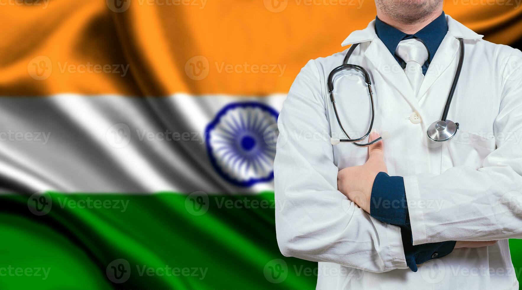 Doctor with stethoscope on India flag. Doctor with arms crossed on India flag background. Medical health and care on Indian flag photo