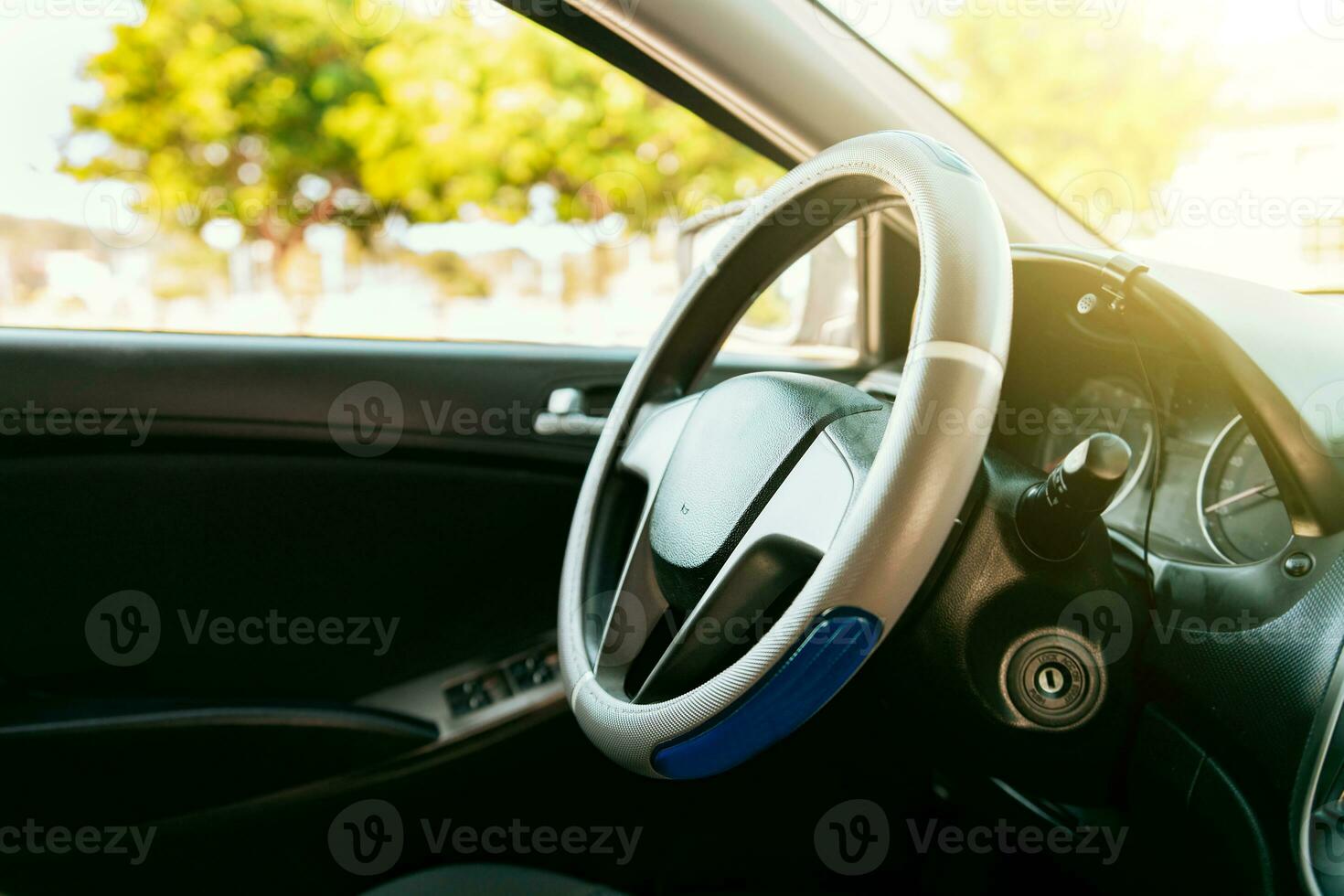 Close up of car steering wheel. Side view of a car steering wheel. A car wheel with copy space. photo