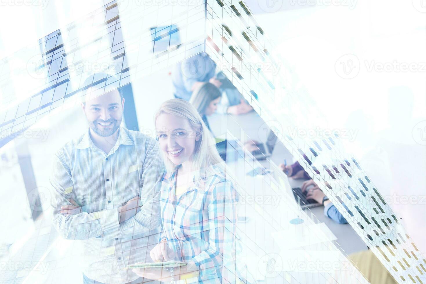 Two Business People Working With Tablet in office photo