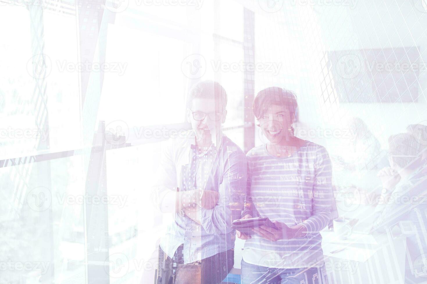 Two Business People Working With Tablet in office photo