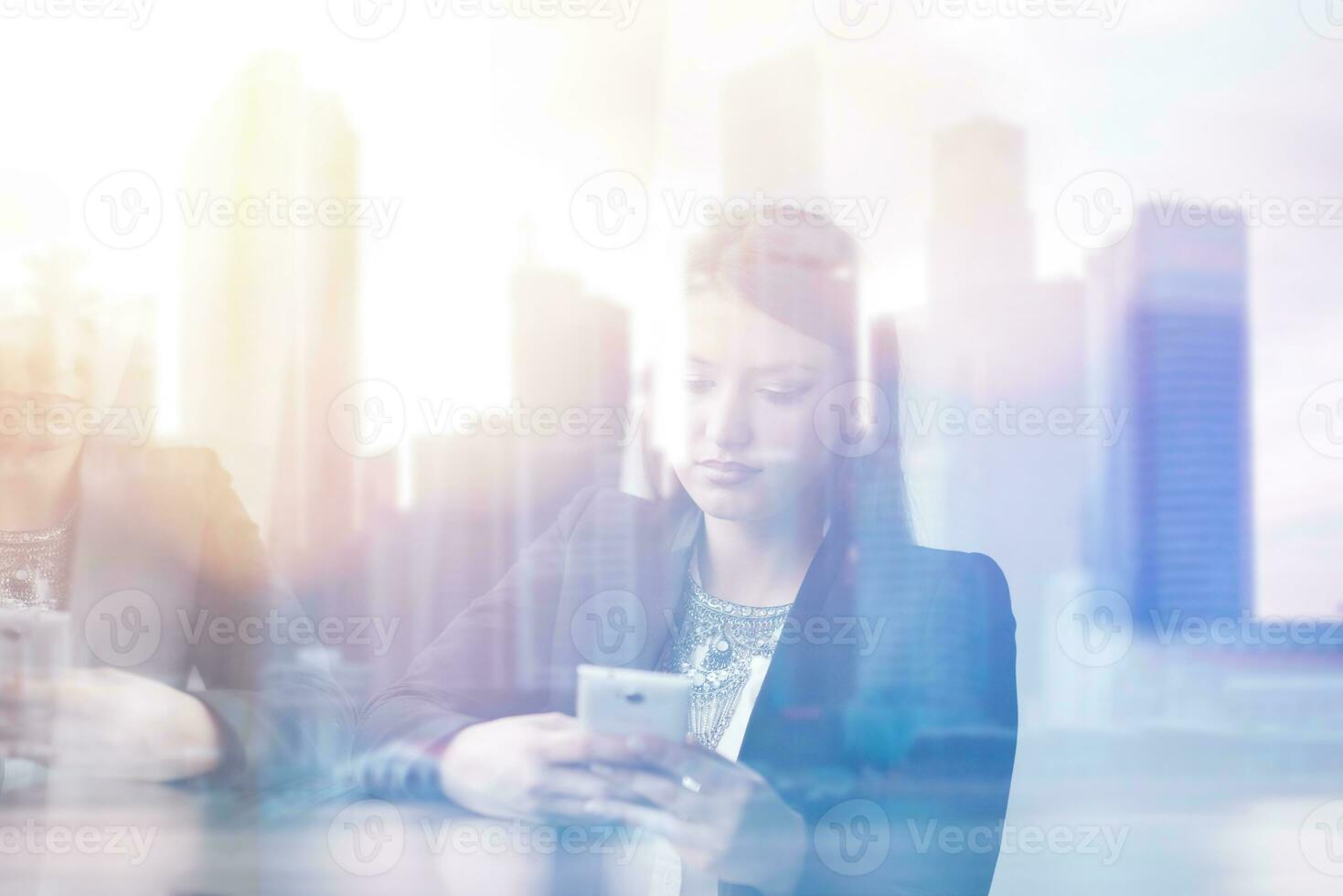 Business Girl Standing In A Modern Building Near The Window With Phone photo