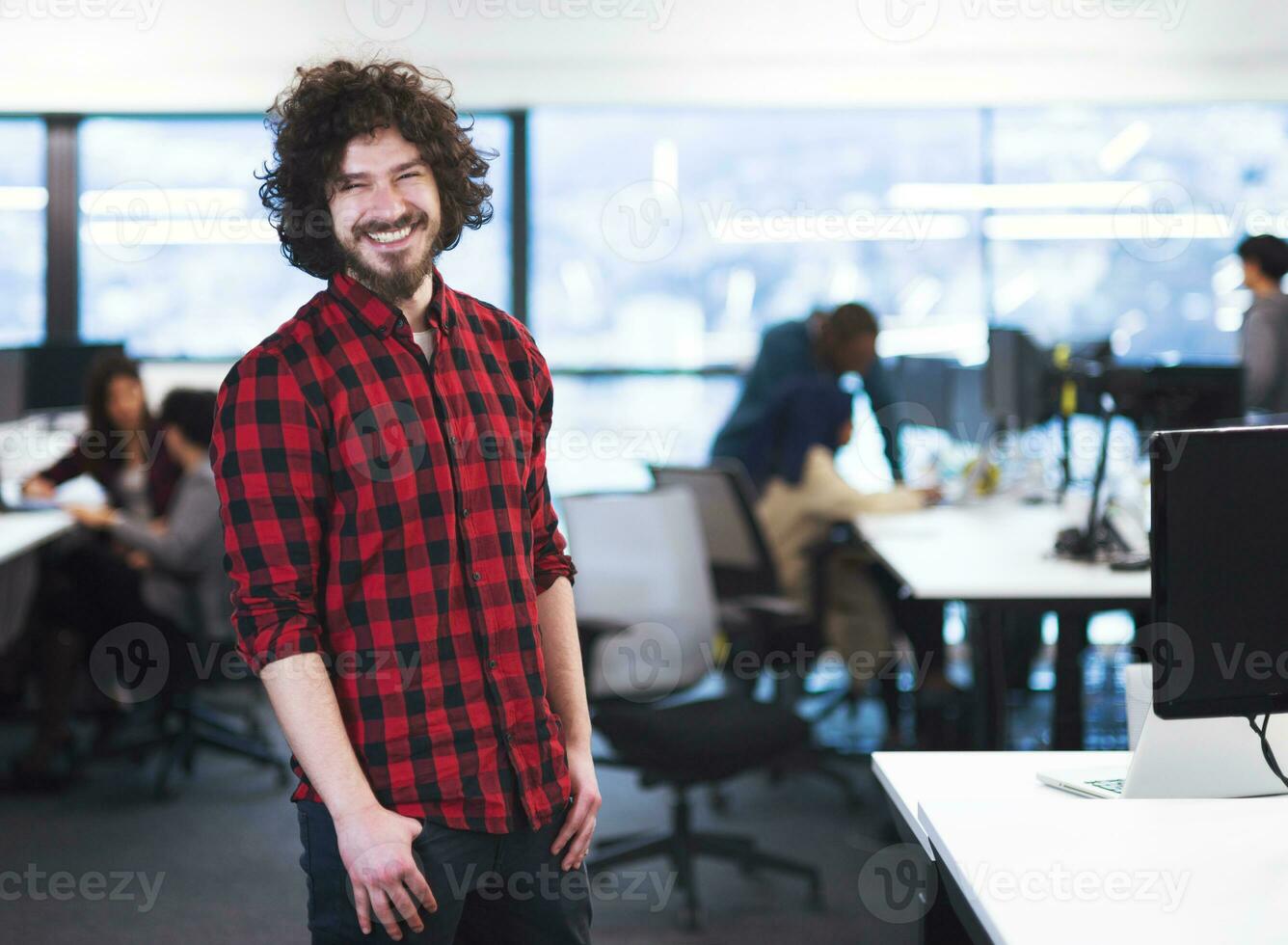 Portrait of smiling male software developer photo