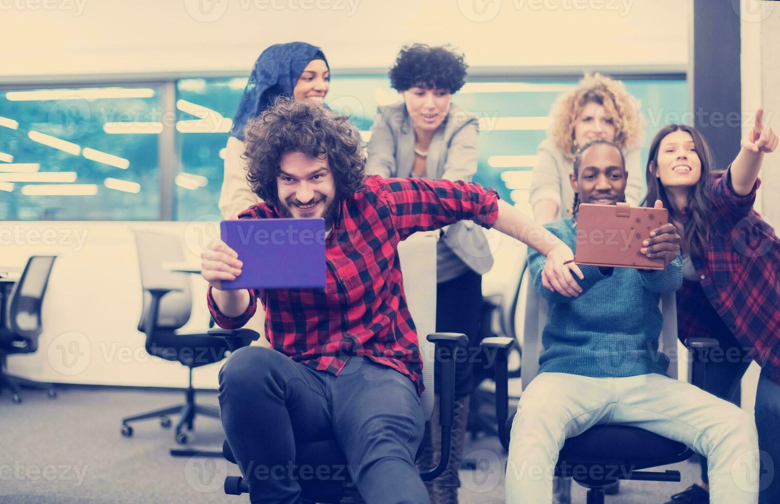 multiethnics business team racing on office chairs photo